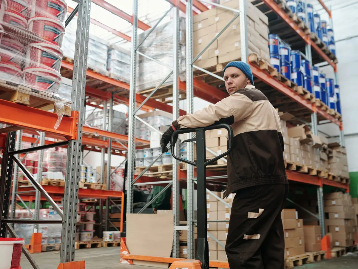 Lithium electric pallet truck, semi-electric pallet truck and hand pallet truck lined up on a cash and carry floor